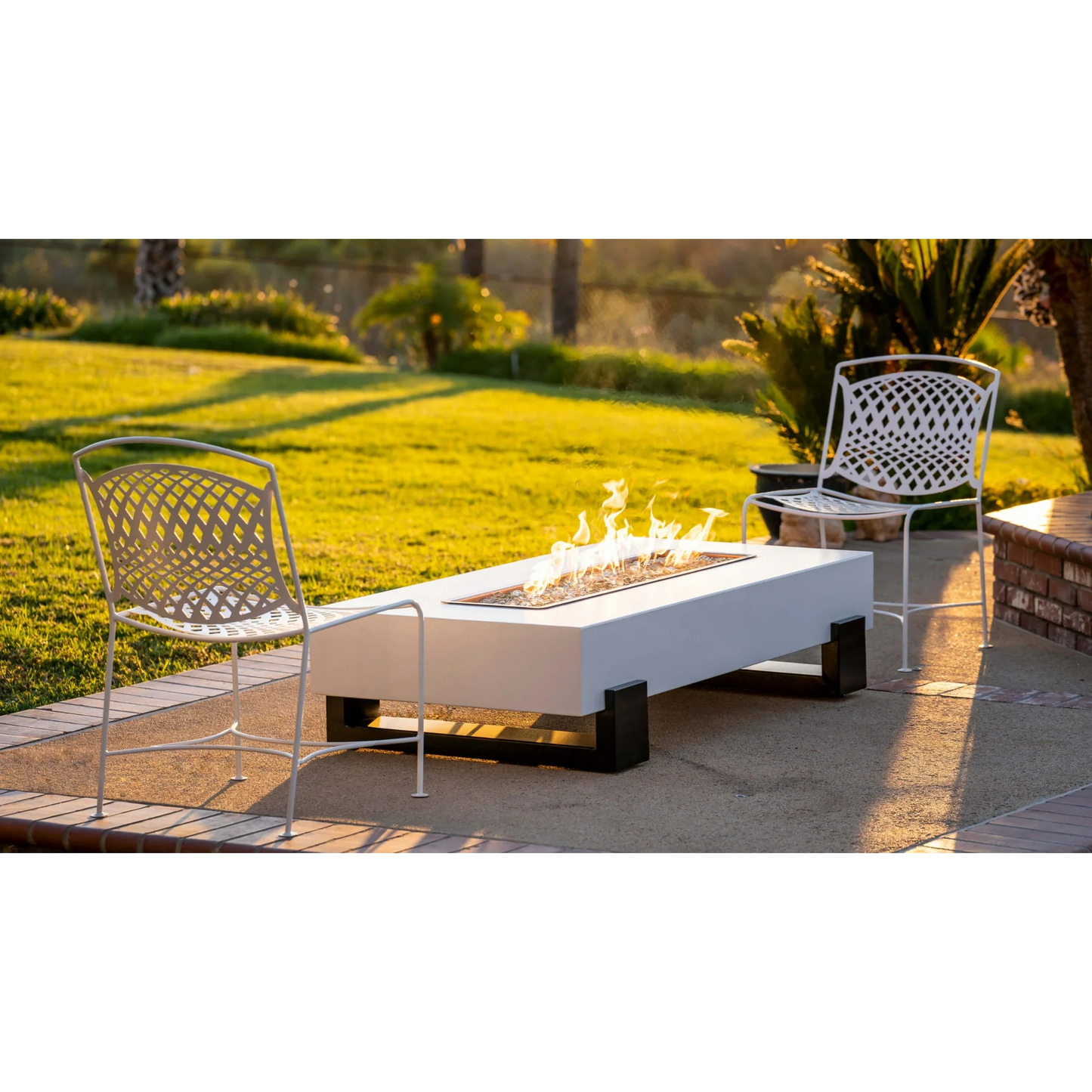 Lifestyle Baja Fire Pit with head to head white chairs