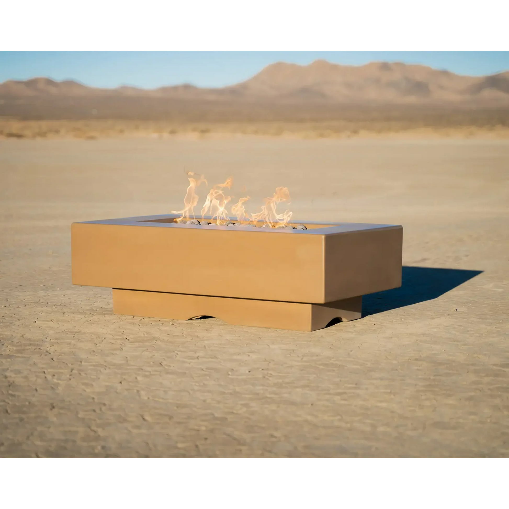 A chestnut colored Del Mar Ourdoor Fire Pit in the desert from a different angle