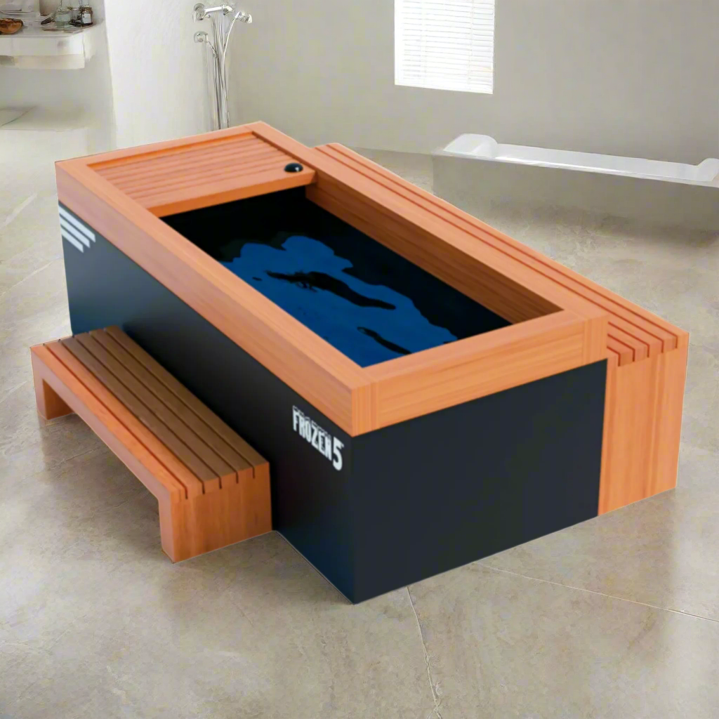 Frozen 5 cold plunge tub by Medical Breakthrough in a modern indoor setting, featuring a wood-accented rim, deep basin, and ergonomic bench.