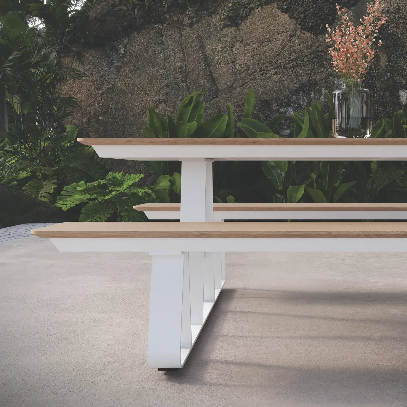 Modern outdoor dining table with benches on a patio