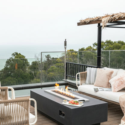 Outdoor patio with furniture and a view of trees and water