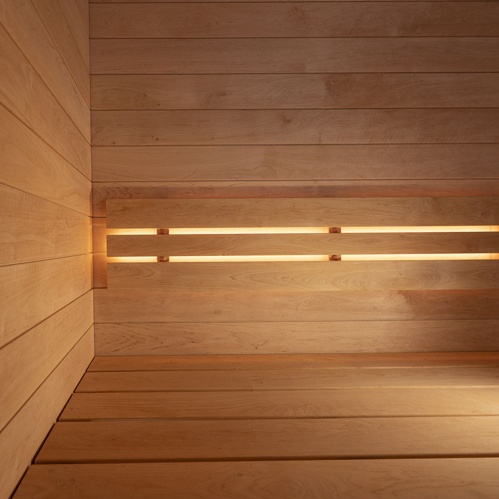 Wooden wall with embedded lights creating a warm glow